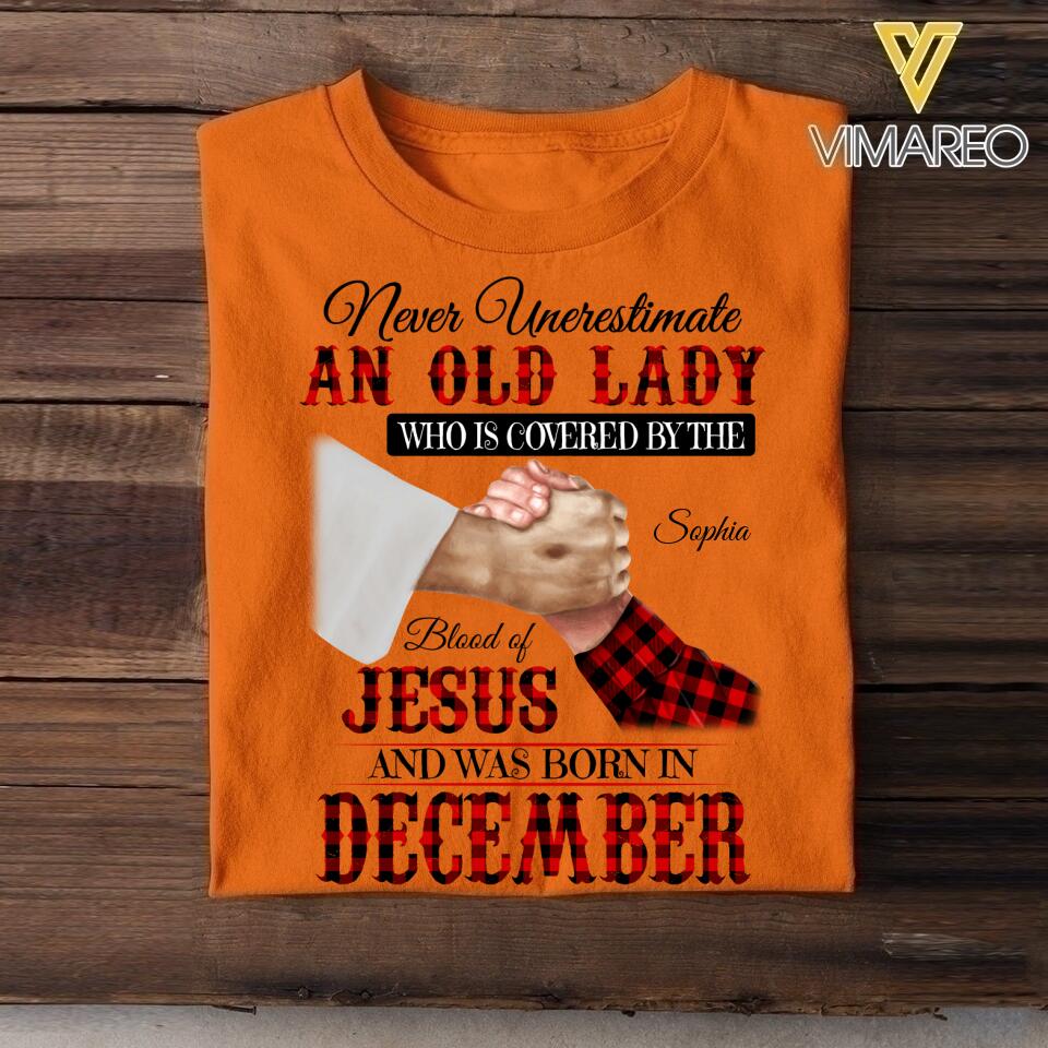 Personalized Never Underestimate An Old Lady Who Is Covered By The Blood Of Jesus And Was Born In December Tshirt Printed 22APR-DT13