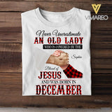 Personalized Never Underestimate An Old Lady Who Is Covered By The Blood Of Jesus And Was Born In December Tshirt Printed 22APR-DT13