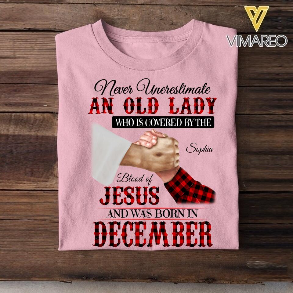 Personalized Never Underestimate An Old Lady Who Is Covered By The Blood Of Jesus And Was Born In December Tshirt Printed 22APR-DT13