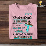 Personalized Never Underestimate A Grandma Who Is Covered By The Blood Of Jesus And Was Born In December Tshirt LDMVQ23409
